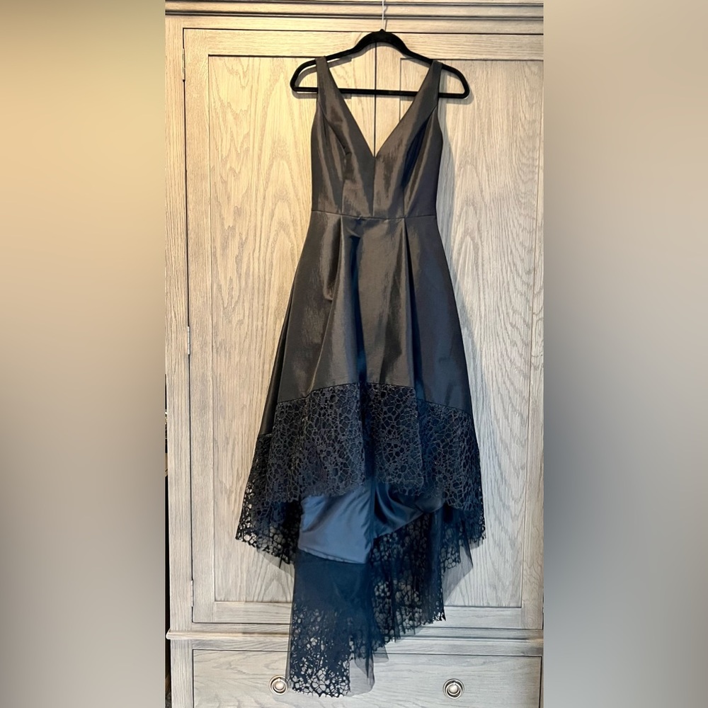 Black sleeveless dress.Short in the front and long in the back.Size 8